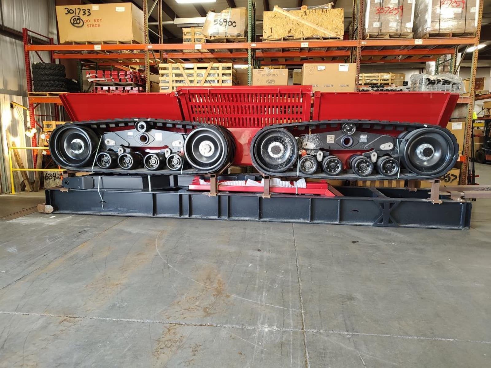 Track undercarriage and main box staged together after the machine was reduced to its major sections